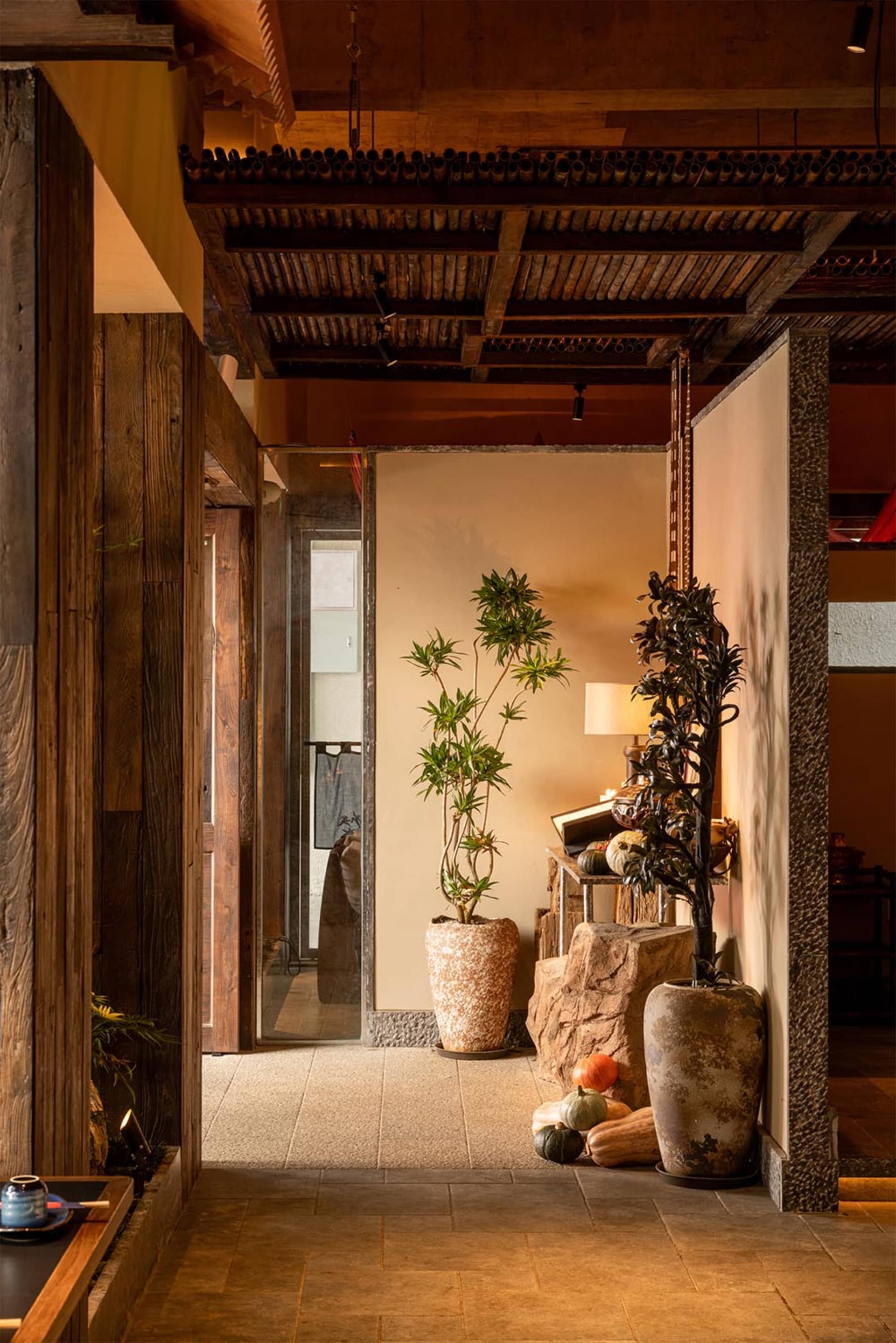 Cozy living space with a wooden floor, decorative elements, and natural light