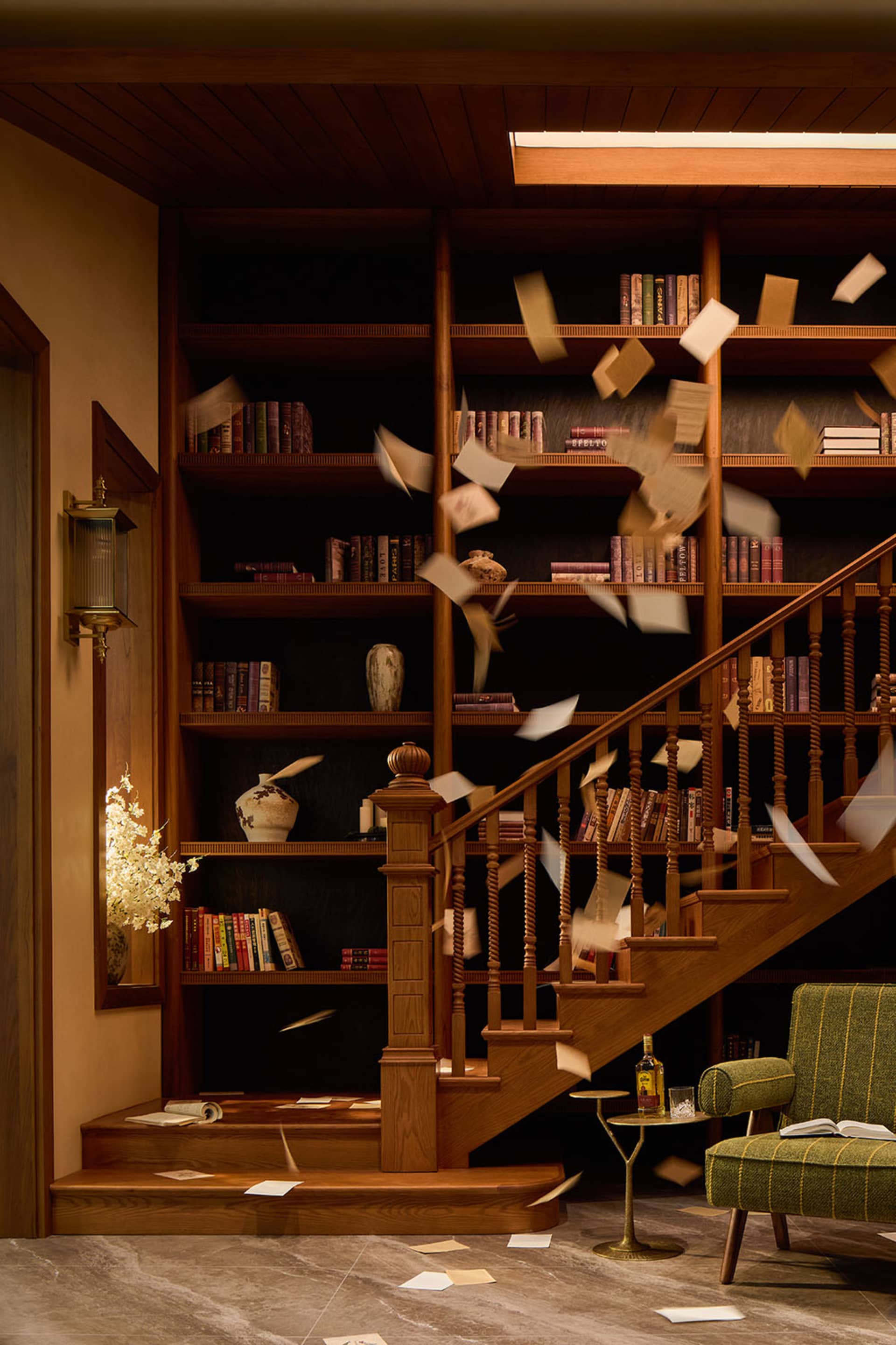 A cluttered room with a staircase, wooden railing, and a bookshelf with scattered books, creating a sense of disarray
