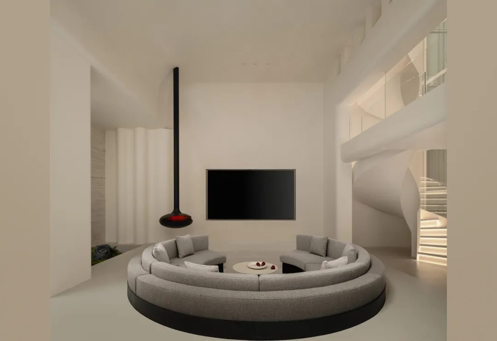 Modern double-height living room featuring a large circular gray sectional sofa, black suspended fireplace, wall-mounted TV, and a sculptural white spiral staircase in the background.