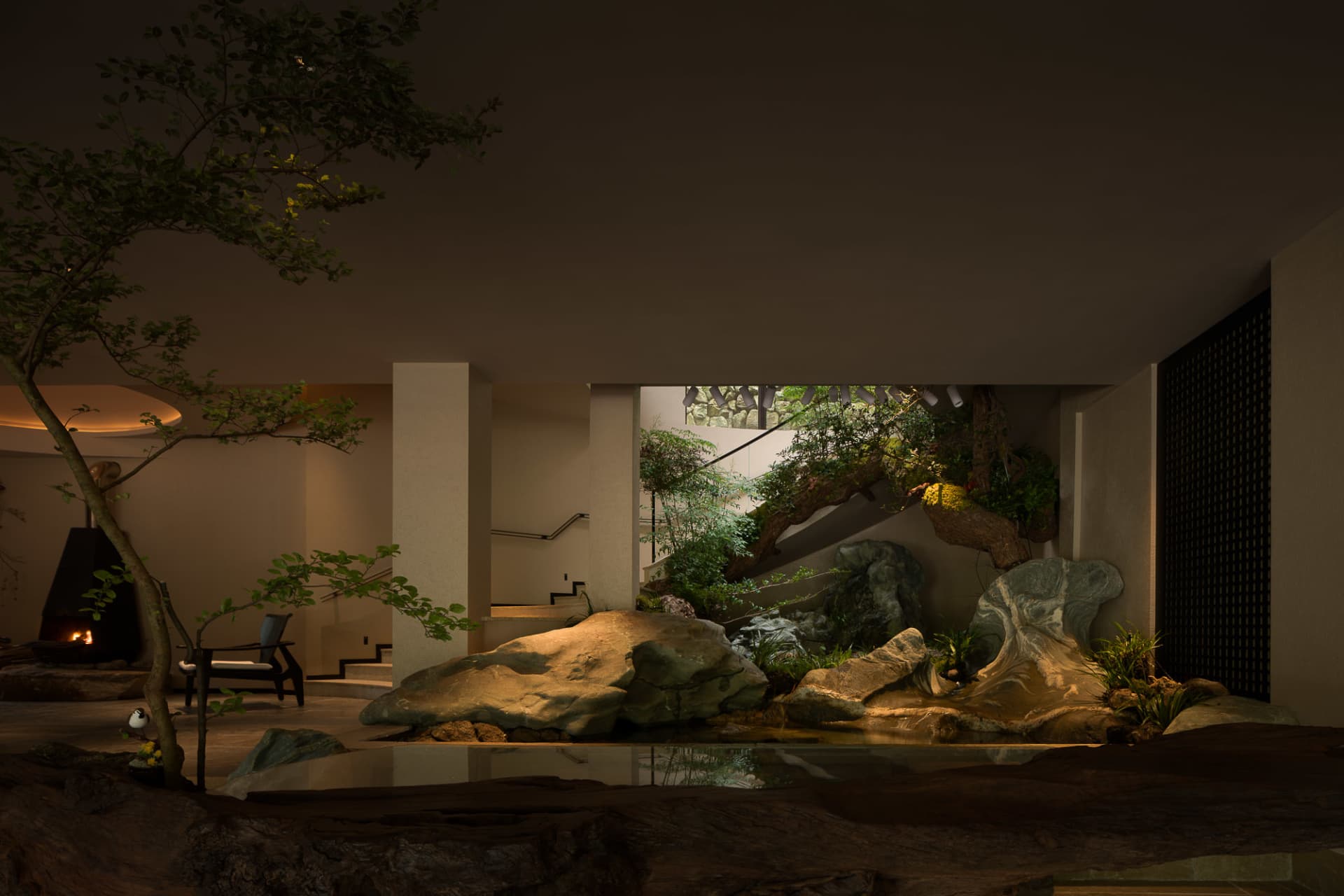 Modern indoor garden featuring large natural rock formations, a koi pond, bonsai trees, a black fireplace, and dramatic uplighting in a contemporary living space.