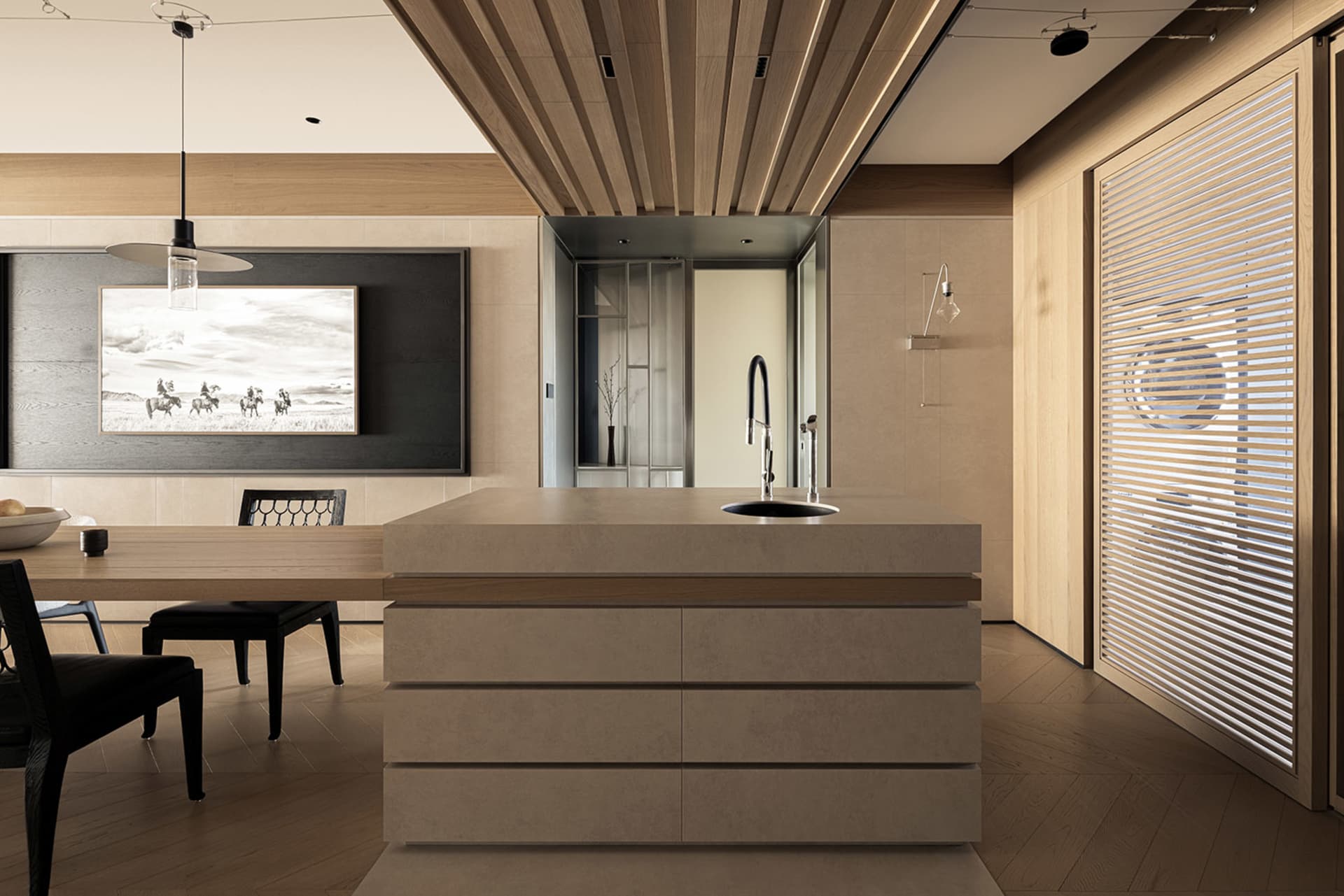 Modern open-plan kitchen and dining area featuring a large concrete kitchen island with oak base, black dining chairs, wooden slat ceiling, and a large black-and-white photograph on the wall.