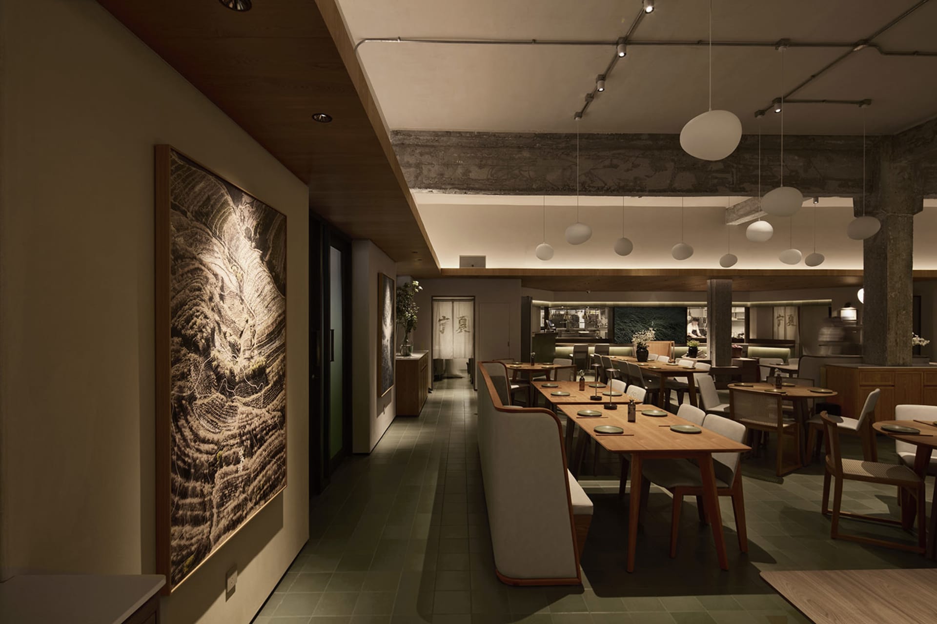 Modern Japanese restaurant interior with warm wood dining tables, upholstered banquettes, terrazzo flooring, exposed concrete beams, and large landscape artwork on the wall.