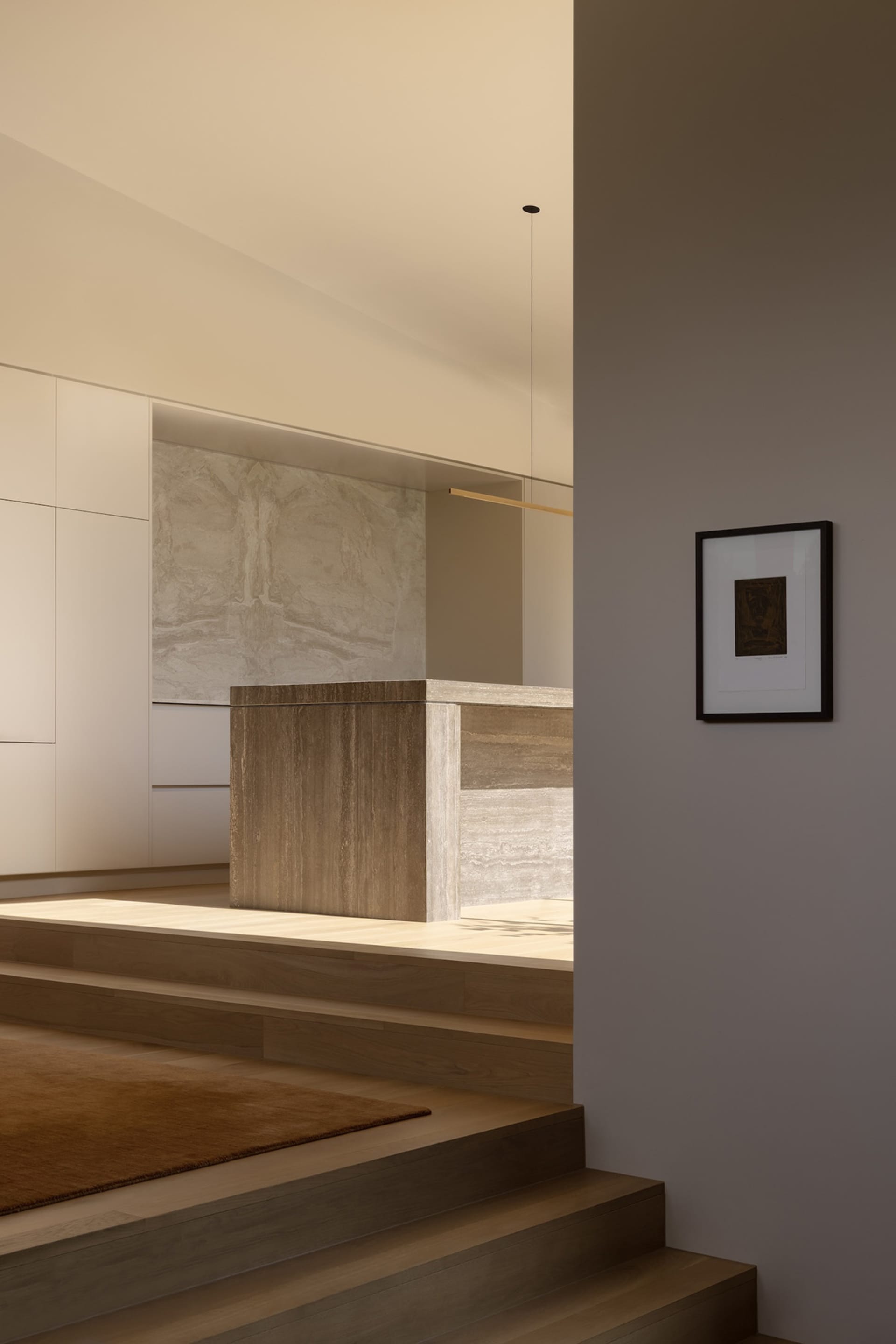 Modern minimalist split-level staircase with travertine marble wall, warm wood treads, and integrated lighting.
