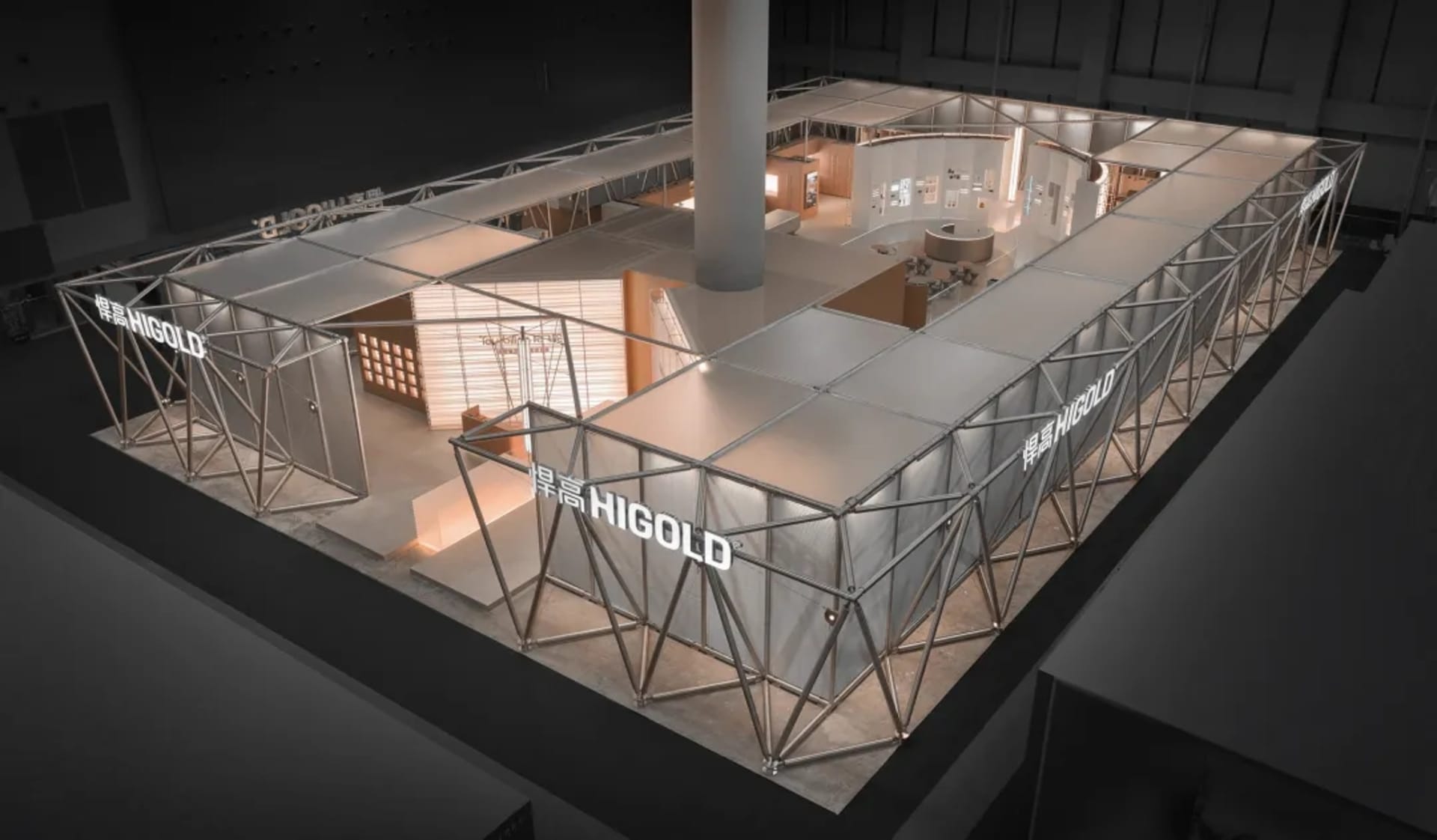 Overhead view of a large modular exhibition booth constructed with a silver steel truss system and fabric panels, branded with Higold, featuring multiple illuminated interior display rooms.