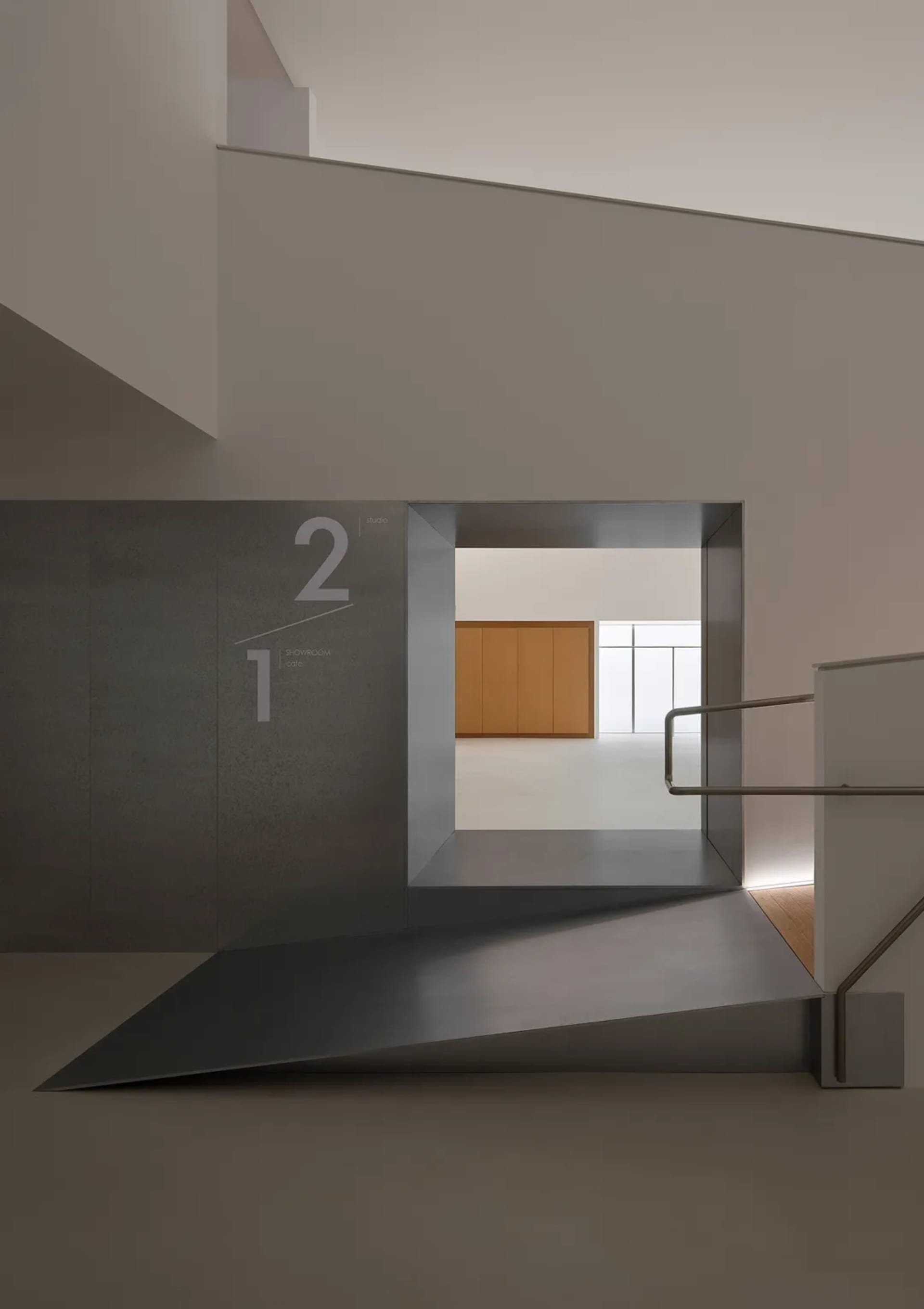 Modern minimalist concrete staircase with floating platform leading to a bright upper-level showroom with wooden cabinetry