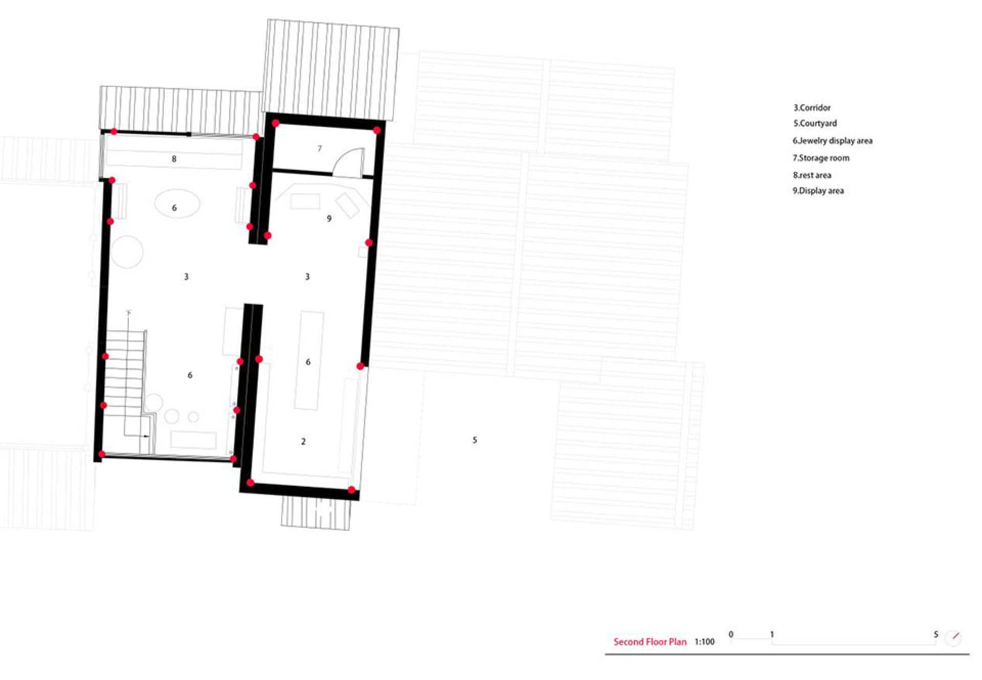 Black and white architectural second floor plan with red dot markers, showing numbered rooms including courtyard, jewelry display area, storage room, rest area and display area at 1:100 scale.