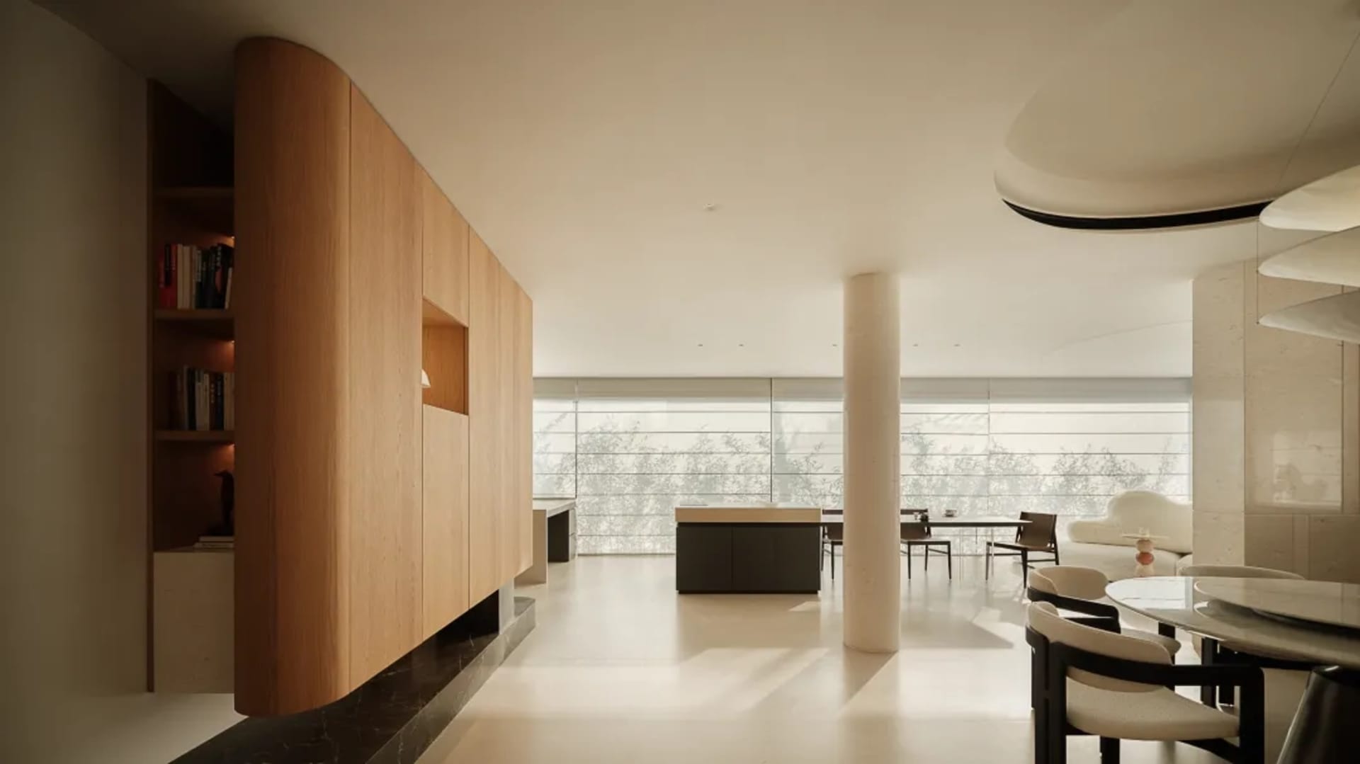 Modern open-plan living, dining and kitchen area featuring a curved light oak cabinet wall, white marble dining table with dark wood chairs, central structural column, and floor-to-ceiling windows overlooking trees.