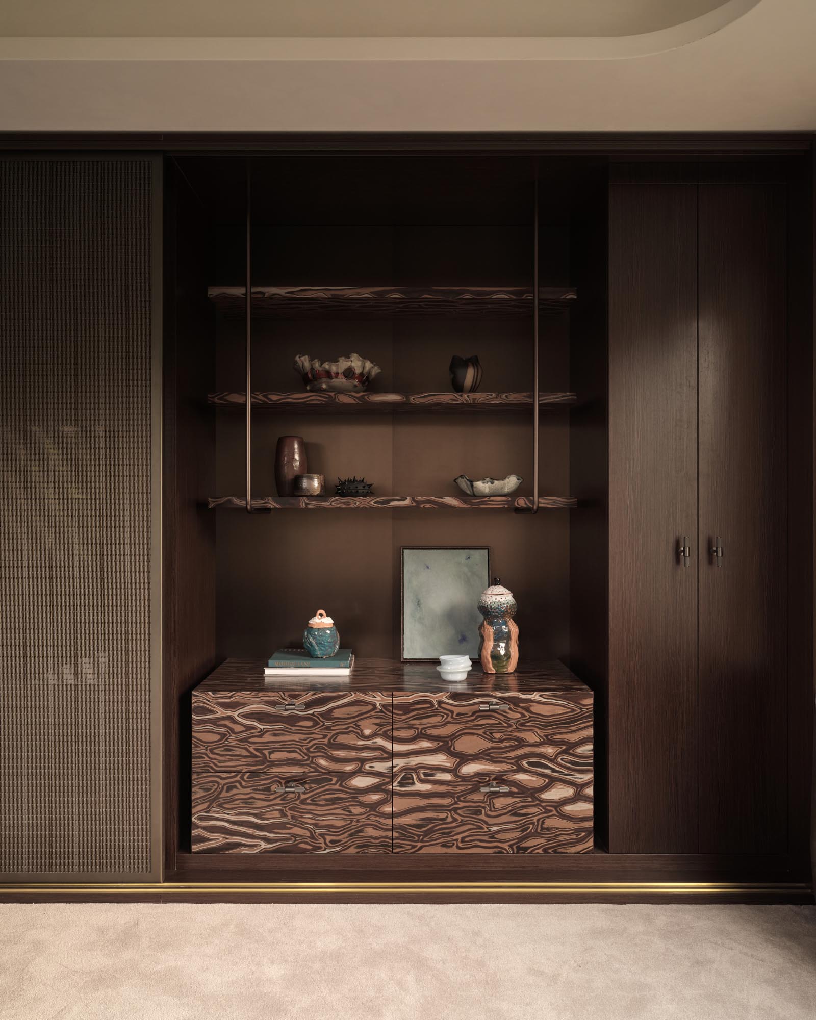 Modern dark wood storage display suited to a narrow Japandi apartment entryway.