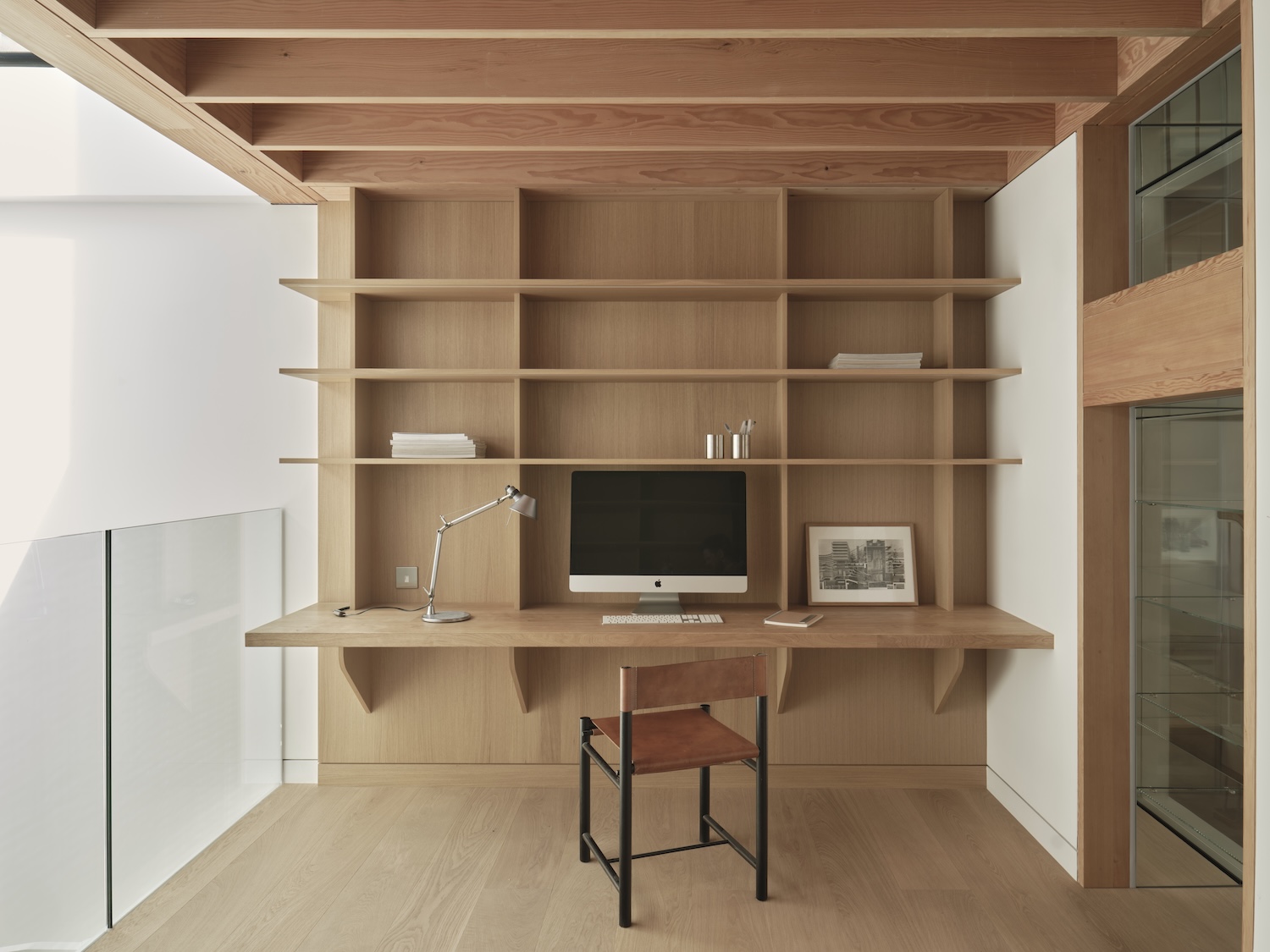Modern minimalist study nook with a clean desk setup, showing how a compact space becomes a small home office.