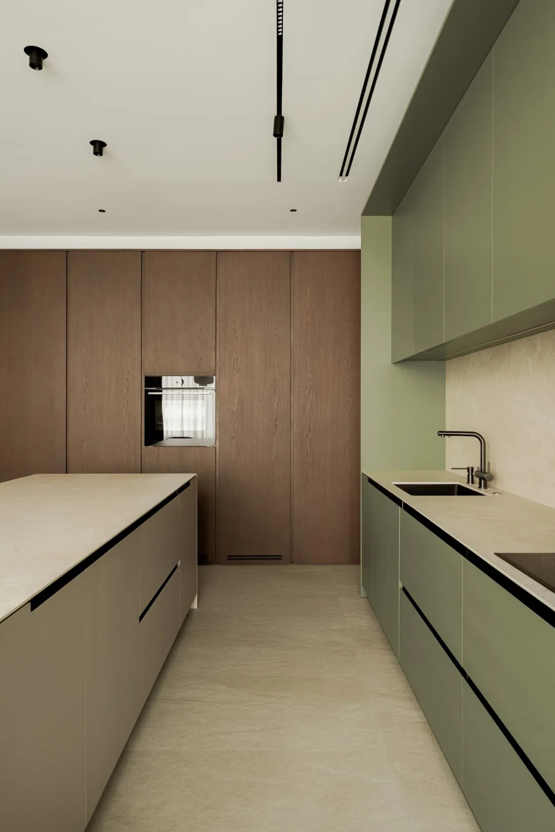 Minimalist residential kitchen with warm wood composite cabinets, clean countertops, and a seamless neutral finish.