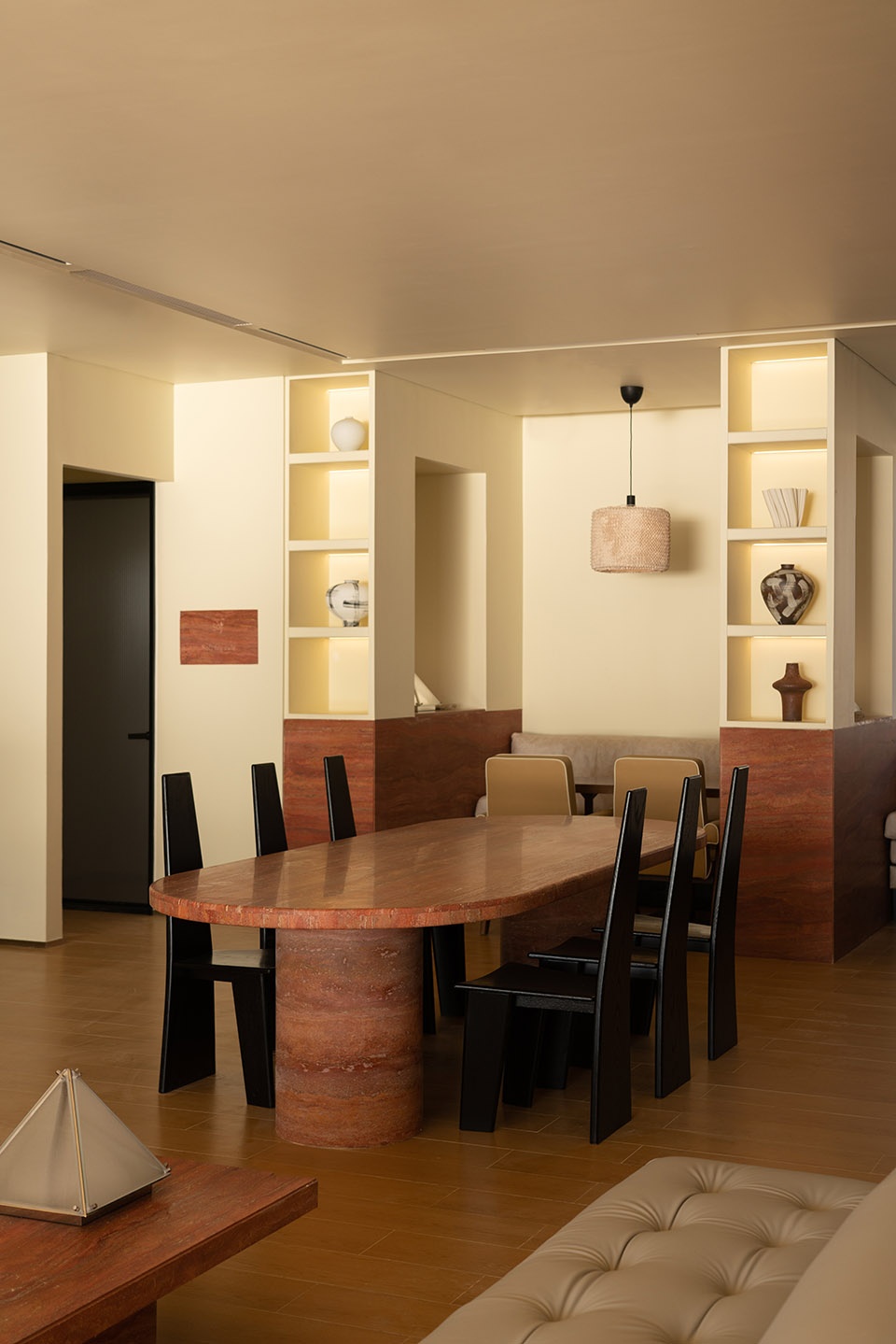 Small apartment dining nook with modular furniture and warm wood accents.