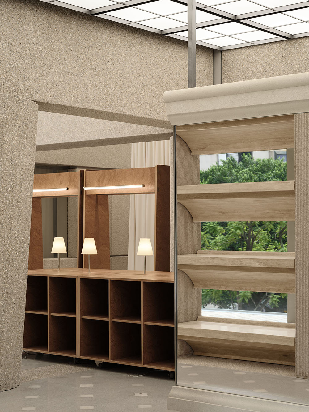 Modern wood shelving unit used as a room divider in a compact neutral-toned minimalist interior.