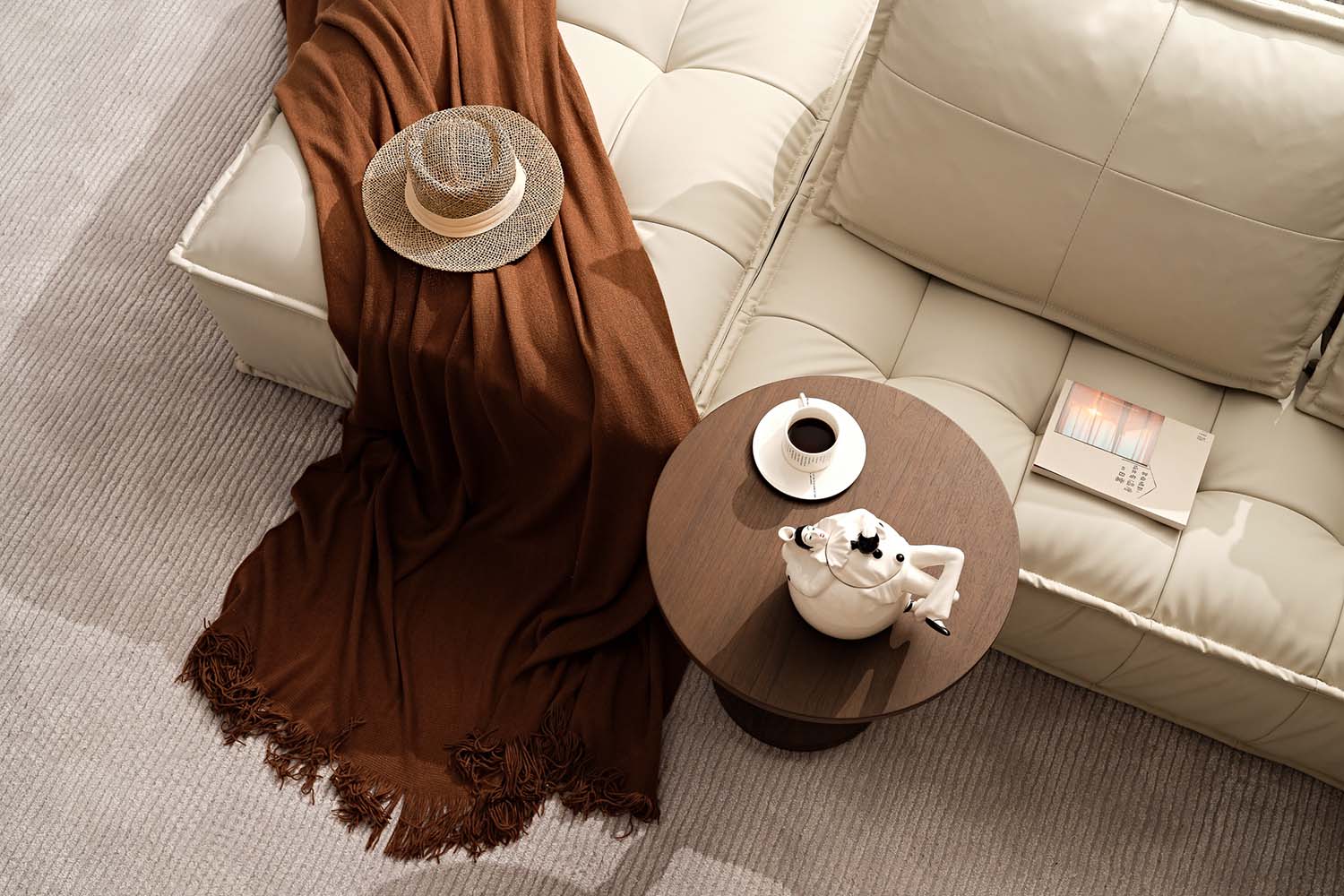 Cozy living room corner with a knit blanket and tea set, layered in warm mocha and earthy tones.