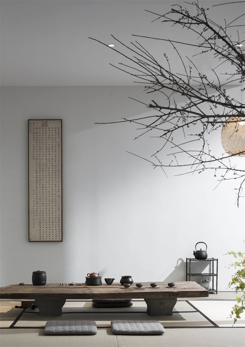 Serene tea room with teak wood surfaces, neutral ceramics, and soft natural textures in a japandi palette.