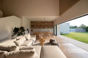 Modern living room with neutral-toned furniture and minimalist design.
