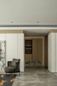 A modern private bathroom with marble features and a private jacuzzi.