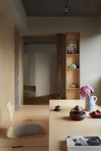 Modern hallway featuring wood, concrete, and brick materials