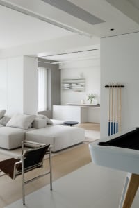 Modern minimalist living room featuring fabric and wood materials with a sleek and clean design.