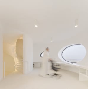 A modern office space with a minimalist design and white color scheme.