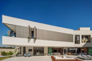 Modern residential building with concrete and glass materials.