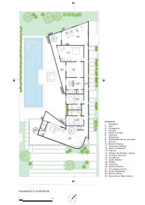 Modern residential house with floor plan detailing rooms such as kitchen, living room, bedrooms, and bathrooms.