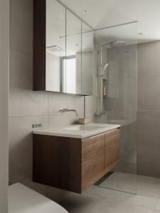 Modern bathroom with concrete walls and floor, minimalist design, and floating vanity