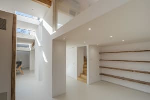 Modern staircase featuring concrete and wooden steps in a minimalist interior design setting.