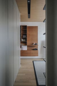 Modern minimalist interior with a wooden wardrobe and minimalist design.