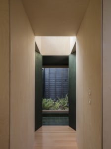Minimalist interior design featuring wooden panels and sleek, clean lines.