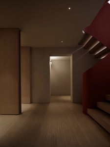 Modern interior design featuring timber stairs and corridor.