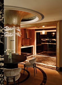 Modern kitchen featuring marble countertops and flooring.
