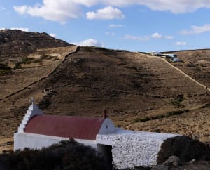 White-roofed stone buildings on a mountain top
