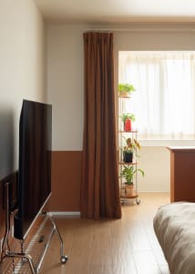 A minimalistic kitchen with wooden curtains and linoleum flooring