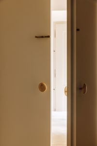 Modern minimalist interior with brass door handles