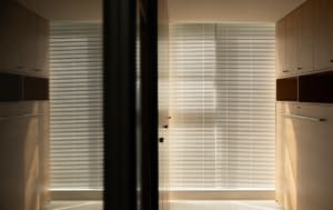Modern minimalist wardrobe with wooden and metal materials.