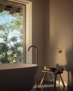 Minimalist bathroom featuring a freestanding concrete bathtub and a copper faucet with views of green foliage outside a large