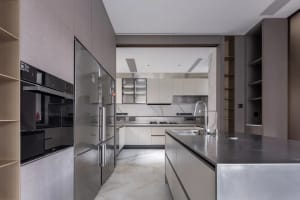 Modern kitchen with marble countertops and stainless steel appliances