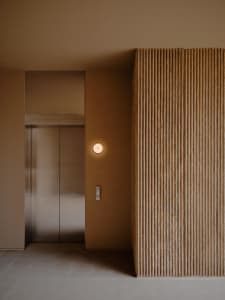 Modern industrial lobby with concrete walls and a minimalist design.