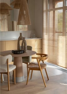 Modern kitchen with woven chairs and wooden furniture