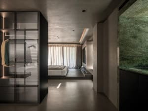 Modern bedroom featuring a concrete floor and minimalist design.