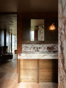 Modern bathroom with marble countertop and terrazzo flooring