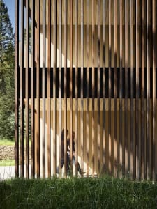 A modern building facade featuring vertical wooden slats.