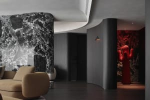A modern living room featuring marble and concrete materials