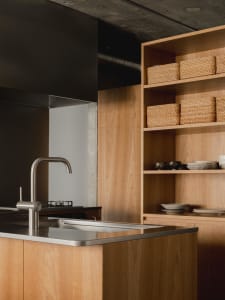 Modern kitchen featuring wooden cabinets and stainless steel hardware.