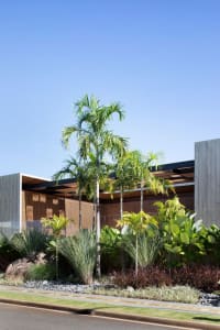 Modern architecture featuring a concrete window and wood interiors.