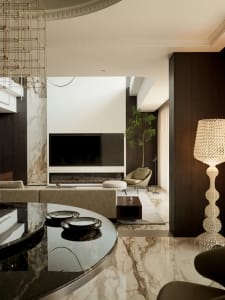 Modern living room featuring marble flooring and wood accents.