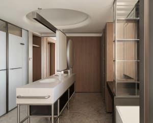Modern bathroom featuring concrete walls and a minimalist design.