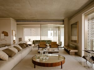 A modern living room featuring concrete materials and minimalist design.