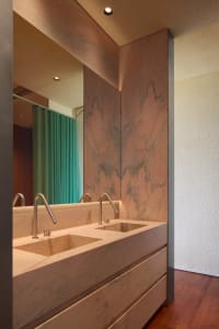 Contemporary bathroom design featuring sleek marble sinks and minimalist fixtures.