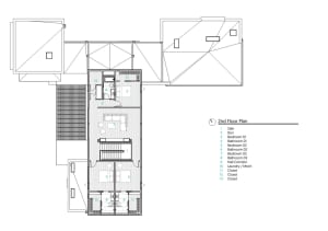 A detailed architectural drawing of a residential floor plan featuring modern design elements and wood and concrete materials